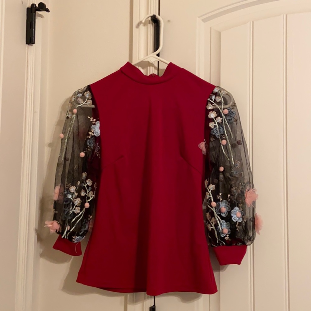 This is a small sized, red blouse from Shein.
